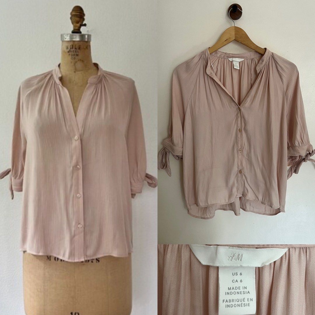 H&M Pink Button-Up Blouse Size US 6 (Category: Blouses) located in General Santos City (Dadiangas). Submitted by dresswithaly (Listing ID 1465412858, Image 1). Description: - Brand: H&M - Color: Soft pastel pink - Size: US 6 (Made in Indonesia) - Style: V-neck button-up with relaxed drape - Details: Gathered shoulder & back pleats, 3/4 sleeves with adjustable tie-bow cuffs - Material: Lightweight textured fabric - Condition: Excellent pre-loved /