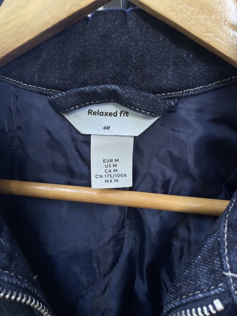 H&M Relaxed Fit Denim Jacket (Category: Coats, Jackets and Outerwear) located in Baguio. Submitted by jomelcavit29012 (Listing ID 1465555237, Image 3). Description: H&M Denim Jacket - Condition : Excellent - Size: M ( Boxy Fit ) - Dimension : 26 / 29 - Color: Dark blue with contrast white stitching - Closure: Full front zipper - Pockets: 1 chest pocket with flap and 2 side pockets - Interior: Quilted blue lining for extra warmth - Cuffs: Adjustab