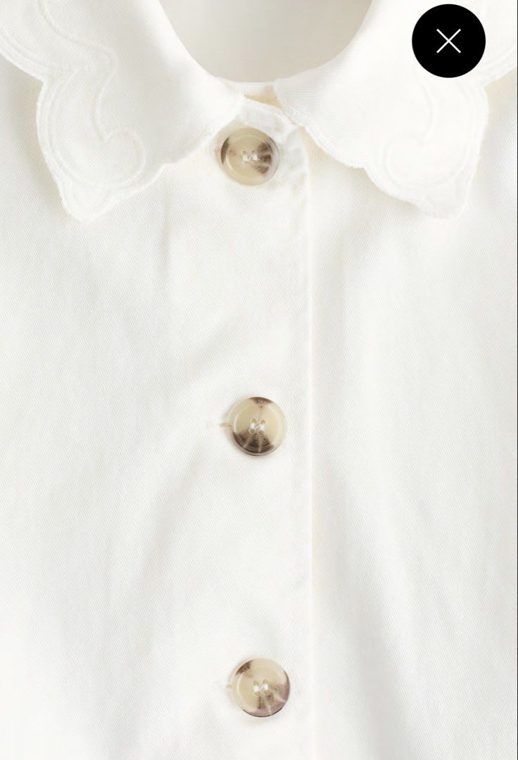 H&M White embroidered button up jacket (Category: Coats, Jackets and Outerwear) located in Paranaque City. Submitted by vestured.ph (Listing ID 1465540539, Image 2). Description: Washed only! Bought for 2,499 - Material: Comfortable white cotton-blend - Design: Cropped length with straight hem - Details: Horn-style front buttons - Accents: Scalloped embroidery on oversized collar, cuffs, and two patch pockets - Style: Great layering piece for coo