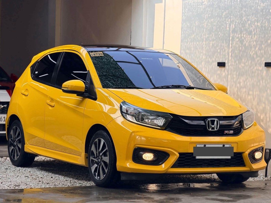 Honda Brio RS Auto (Category: Used Cars) located in Manila. Submitted by quality_cars (Listing ID 1465558262, Image 2). Description: FOR SALE! ‼2021 acq Honda Brio RS Automatic 28K Mileage ONLY — TOP OF THE LINE‼ 🔰59K DP ONLY!🔰 (1-3 Days Fast and Easy Approval) ✅Top-of-the-line RS Variant ✅28K Mileage ONLY! 1.2L i-VTEC Gasoline Engine CVT Automatic Transmission Sporty RS Body Kit LED Headlights with LED DRLs LED Front Fog Lamps 15-inch Two-Tone