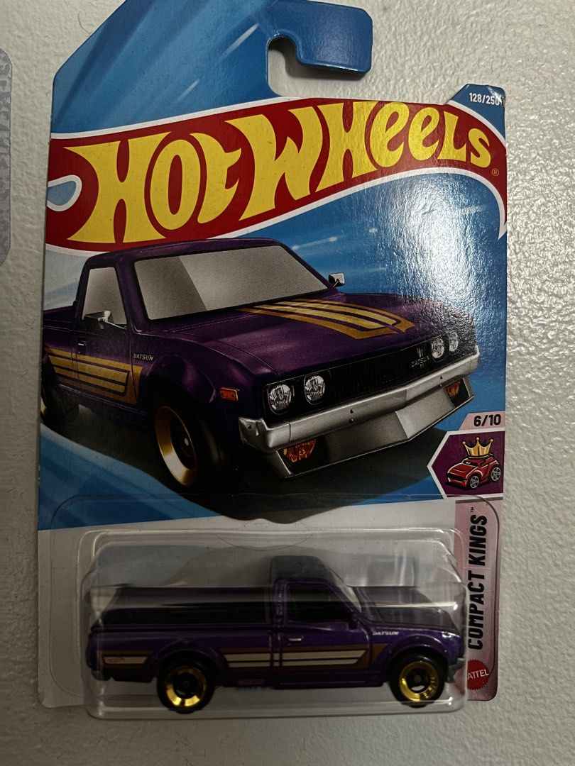 Hot Wheels (Category: Vehicle & Diecast Models) located in Manila. Submitted by jellyb34n (Listing ID 1465389166, Image 2). Description: 120 each - Set of 2 collectible Hot Wheels die-cast cars in original packaging - McLaren Solus GT: Bright green, Exoticars series (74/250) - Datsun Pickup Truck: Purple with gold wheels and racing stripes, Compact Kings series (128/250) - Condition: Cards are unbent with crystal clear plastic blisters - Ideal fo