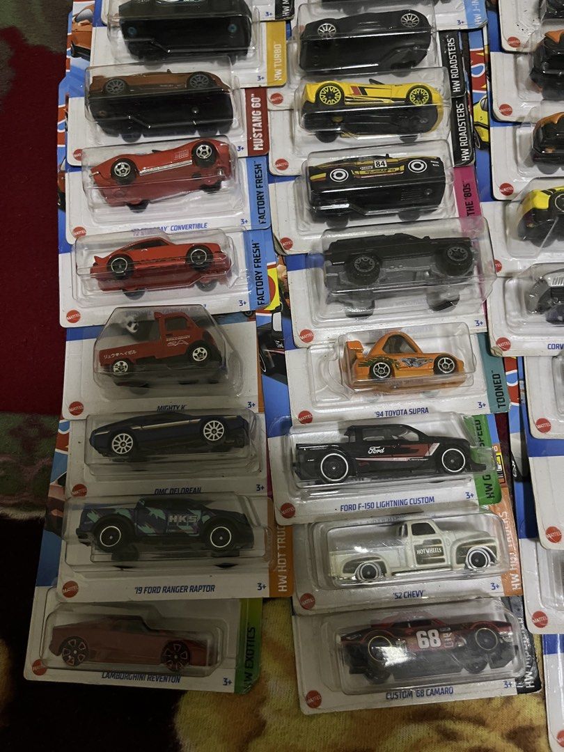 Hot Wheels Assorted Diecast Cars Lot (Category: Vehicle & Diecast Models) located in Manila. Submitted by djomari20631060 (Listing ID 1465528367, Image 2). Description: - Huge collection of Hot Wheels mainline and premium cars - Features top models: Lamborghini Huracan Sterrato, Bugatti Bolide, Ford Mustang, Porsche, Audi, and more - Assorted mix of sports cars, trucks, and classics - Condition: Brand new, unopened in original blister packaging -