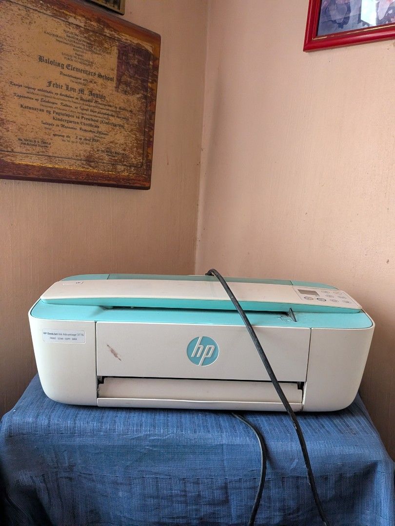 HP DeskJet Ink Advantage 3776 Printer (Category: Printers, Scanners & Copiers) located in San Jacinto. Submitted by jigssaw (Listing ID 1465455530, Image 1). Description: - Model: HP DeskJet Ink Advantage 3776 All-in-One Printer - Functions: Print, scan, copy, and web-enabled - Design: Compact white and turquoise body with top-right control panel and white backlit power button - Condition: Minor scuffs and dust marks, fully functional - Perfect f