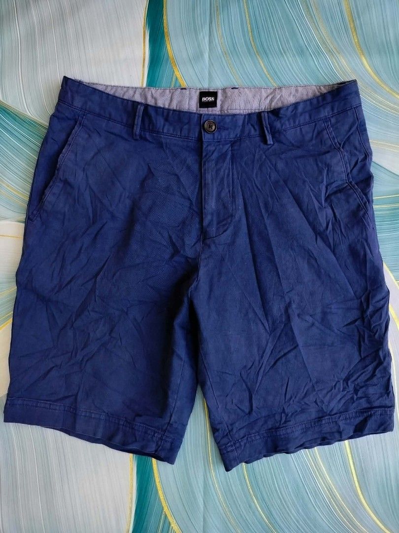 Hugo Boss Blue Slice-Short Size 30 (Category: Shorts) located in Manila. Submitted by virgiliosa38485 (Listing ID 1465500164, Image 1). Description: - Brand: Hugo Boss - Color: Classic Blue - Size: 32 US -Waist 32-33 -Length 19 - Material: 97% cotton, 3% elastane for a comfortable stretch - Features: Button fly with branded hardware, patterned interior waistband lining - Care: Machine wash cold, hang dry - Condition: Excellent / Well-maintained.