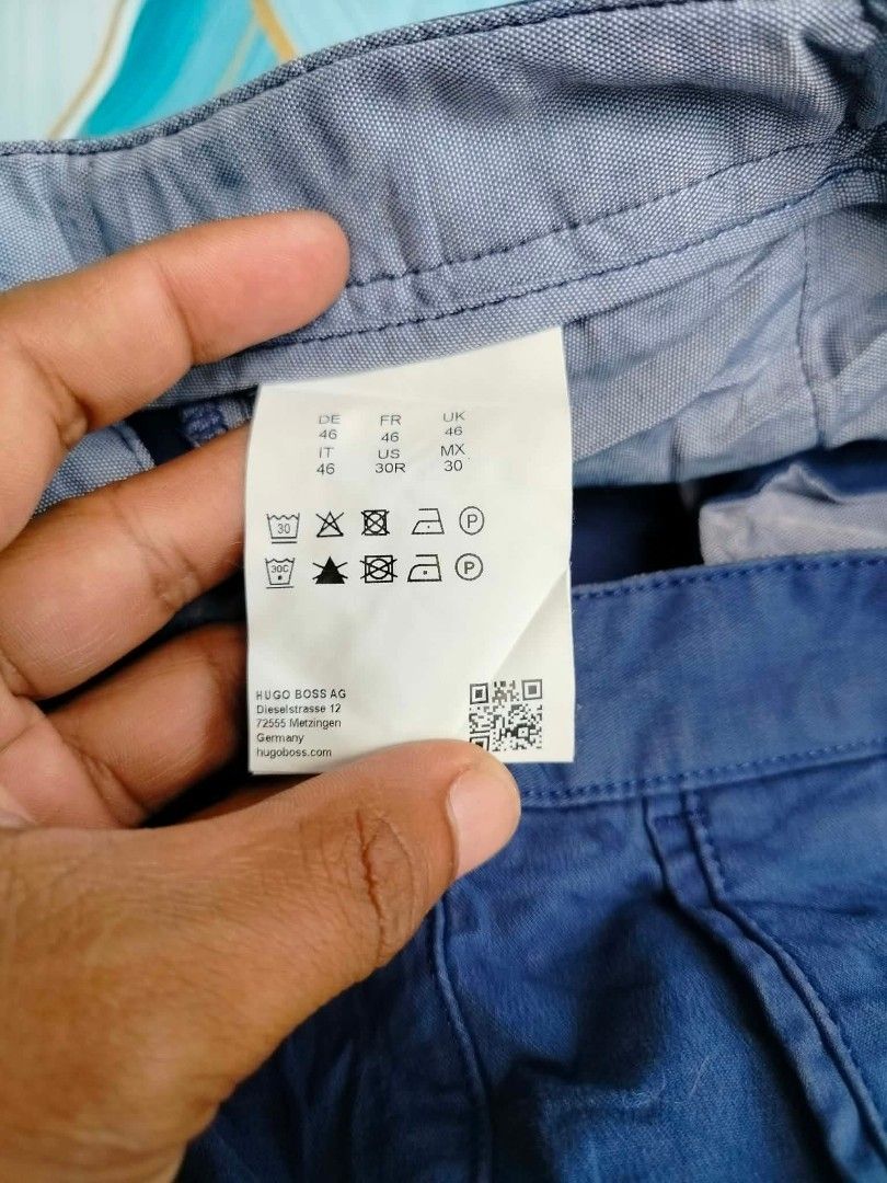 Hugo Boss Blue Slice-Short Size 30 (Category: Shorts) located in Manila. Submitted by virgiliosa38485 (Listing ID 1465500164, Image 3). Description: - Brand: Hugo Boss - Color: Classic Blue - Size: 32 US -Waist 32-33 -Length 19 - Material: 97% cotton, 3% elastane for a comfortable stretch - Features: Button fly with branded hardware, patterned interior waistband lining - Care: Machine wash cold, hang dry - Condition: Excellent / Well-maintained.