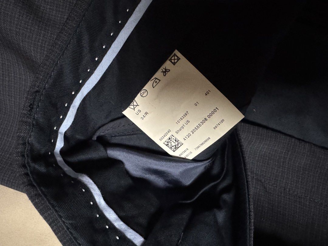 Hugo Boss Sharp1 US 34/R Trousers (Category: Trousers) located in Manila. Submitted by seangoart (Listing ID 1465521842, Image 2). Description: - Brand: Hugo Boss - Model: Sharp1 US - Size: 34/R - Color: Dark charcoal grey - Fit: Tailored fit - Features: Belt loops, buttoned rear pockets, inner waist grip lining - Condition: Clean interior labels attached, well-maintained - Ideal for: Formal events, business meetings, or smart-casual wear.