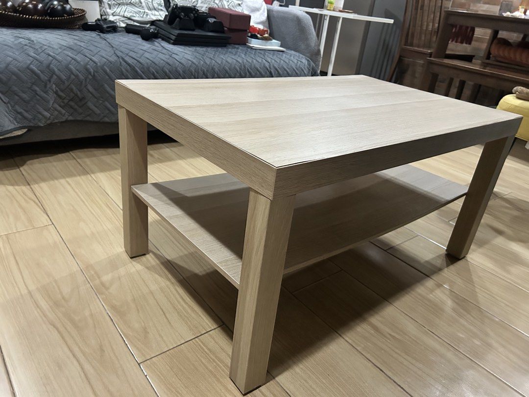Ikea Lack wood coffee table with bottom shelf (Category: Tables & Sets) located in Quezon City. Submitted by rock69qm (Listing ID 1465403636, Image 2). Description: - Light wood finish coffee table with a clean, rectangular design - Built-in lower shelf for storing remotes, books, or magazines - Sturdy four-leg construction for everyday stability - Versatile neutral color that matches most home decor - Perfect fit for living rooms or home studies