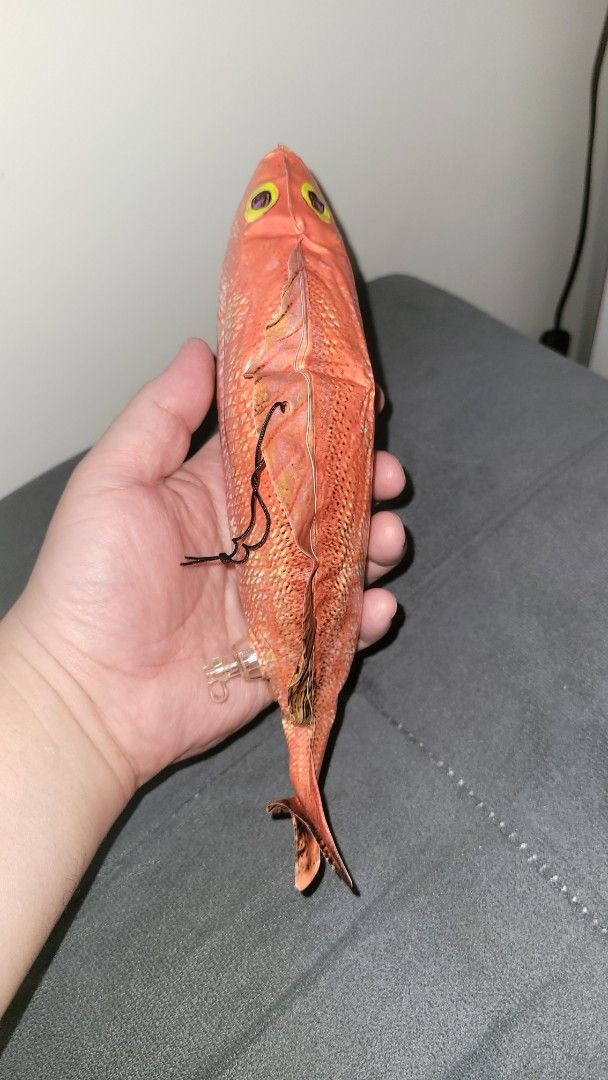 Inflatable Red Snapper Fish Toy with Valve (Category: Kids Toys) located in Pasig City. Submitted by samnok_toys_ph (Listing ID 1465424407, Image 2). Description: - Inflatable red snapper toy featuring a realistic orange and white scale pattern - Detailed design with yellow eyes, fins, and a handy black string loop on the back fin - Features a clear plastic inflation valve on the side for easy setup - Compact, hand-held size ideal for fun, partie