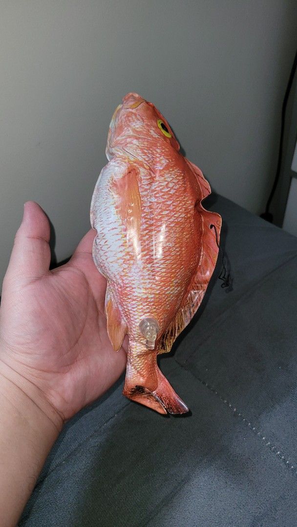 Inflatable Red Snapper Fish Toy with Valve (Category: Kids Toys) located in Pasig City. Submitted by samnok_toys_ph (Listing ID 1465424407, Image 1). Description: - Inflatable red snapper toy featuring a realistic orange and white scale pattern - Detailed design with yellow eyes, fins, and a handy black string loop on the back fin - Features a clear plastic inflation valve on the side for easy setup - Compact, hand-held size ideal for fun, partie