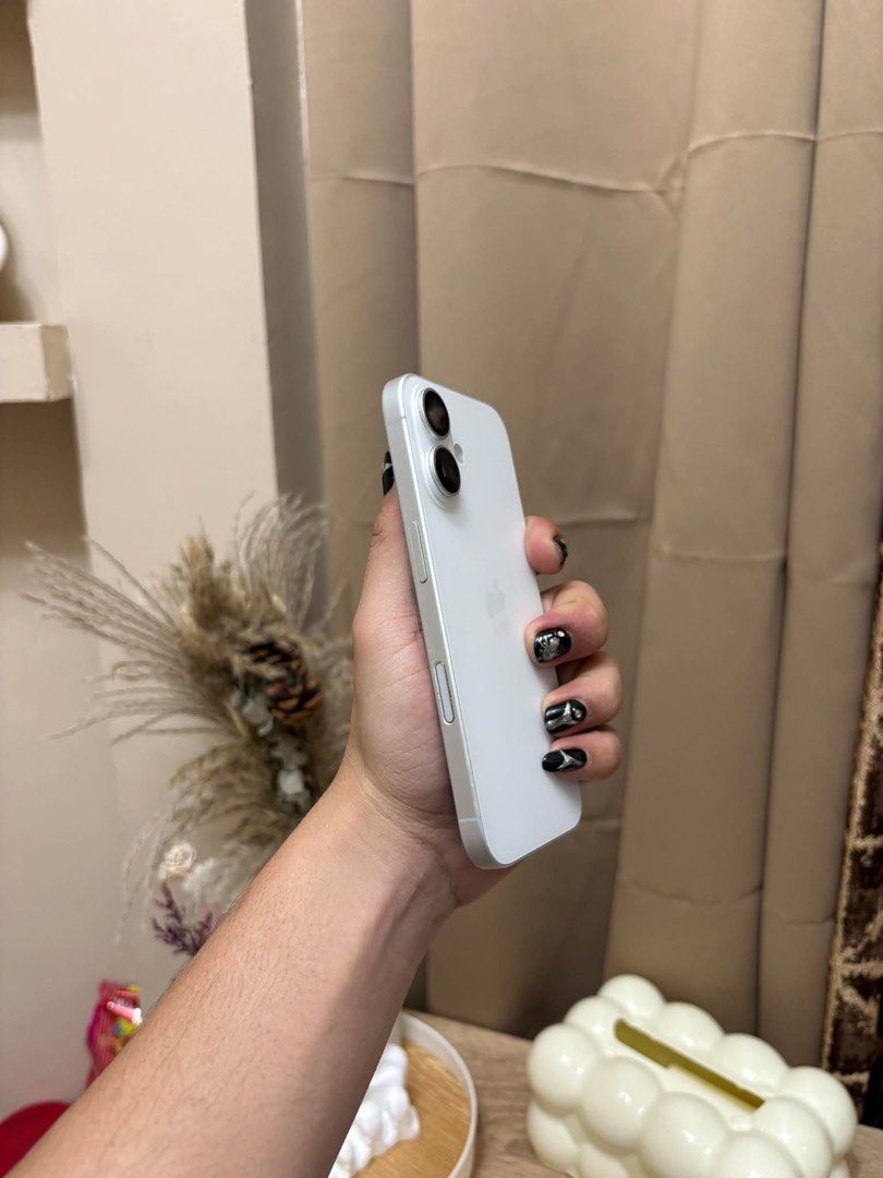 IPHONE 16 128 GB (Category: iPhone 16 Series) located in Manila. Submitted by mightyhorse. (Listing ID 1465419484, Image 1). Description: - Brand/Model: Apple iPhone 16 - Storage Capacity: 128 GB - Color: White - Battery Health: 91% - Condition: Excellent, pre-owned - Features: Sleek design, vibrant display, clean body - Meetup location available: EP Village Phase 1 - Under warranty till nov -inclusion unit case replacement cord.
