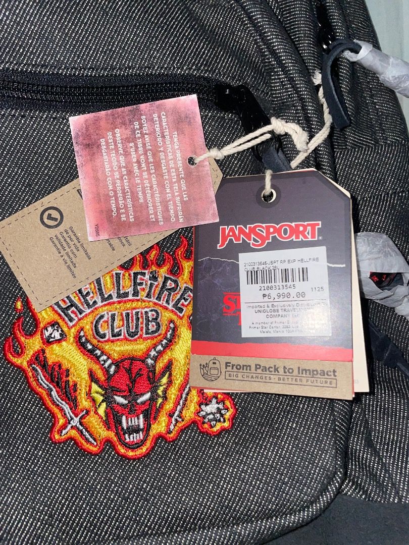 JanSport Stranger Things Hellfire Club Backpack (Category: Backpacks) located in Cebu City. Submitted by michaelbenida (Listing ID 1465406814, Image 2). Description: - Brand: JanSport x Stranger Things (Hellfire Club collection) - Condition: Brand new with original store tags, never used - Material/Design: Dark denim wash with iconic Hellfire Club front patch - Interior details: Red embroidery with JanSport logo tag - Perfect for daily use, schoo