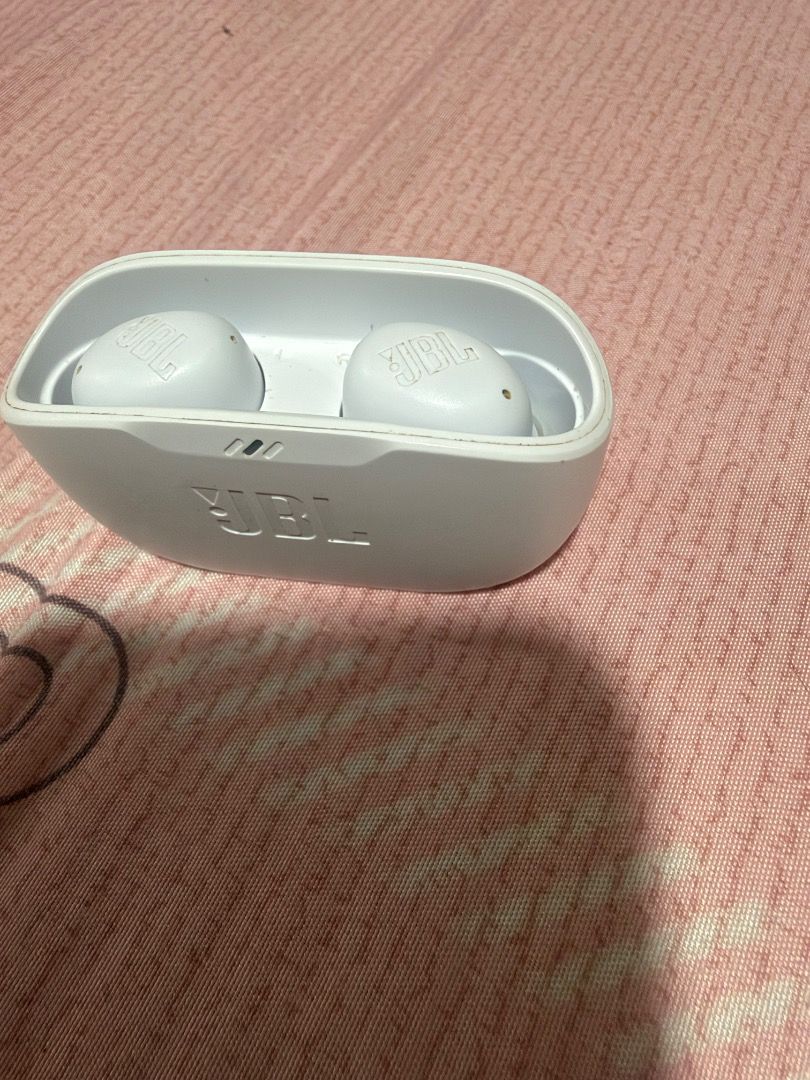 JBL White True Wireless Earbuds with Charging Case (Category: Earphones) located in Manila. Submitted by geoliven159q (Listing ID 1465394731, Image 2). Description: - Authentic JBL wireless earbuds in classic white - Compact charging case included for snug and secure storage - Delivers crisp, good sound quality with a portable design - Hassle-free Bluetooth pairing with smartphones and laptops - Convenient charging via standard USB port - Perfect