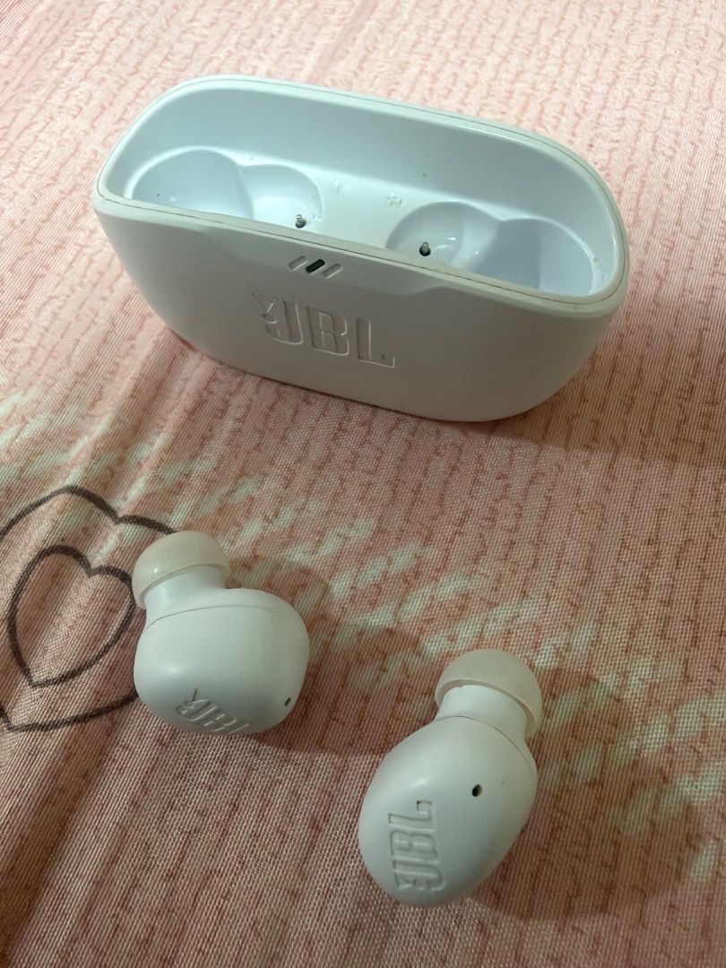JBL White True Wireless Earbuds with Charging Case (Category: Earphones) located in Manila. Submitted by geoliven159q (Listing ID 1465394731, Image 1). Description: - Authentic JBL wireless earbuds in classic white - Compact charging case included for snug and secure storage - Delivers crisp, good sound quality with a portable design - Hassle-free Bluetooth pairing with smartphones and laptops - Convenient charging via standard USB port - Perfect