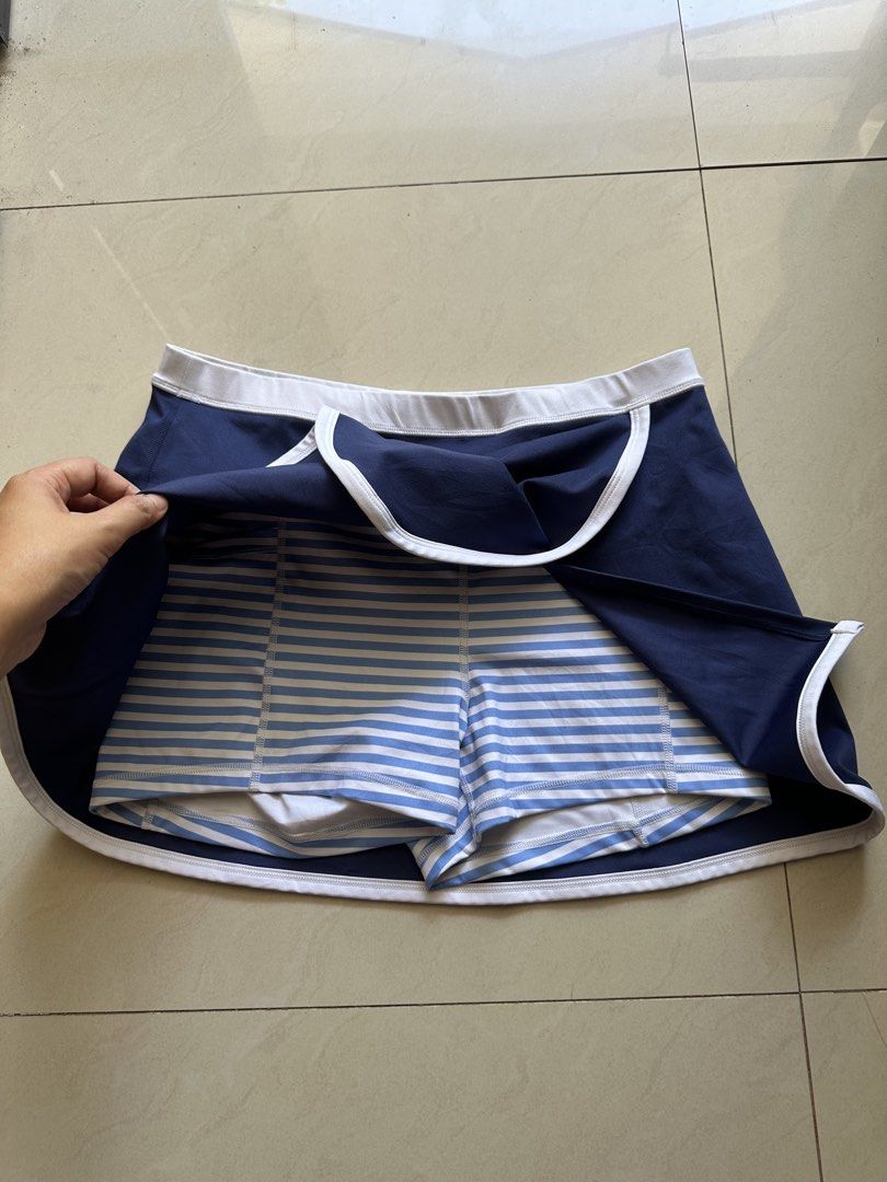 j.crew Active Navy Blue Skort Size M 30-35 (Category: Activewear) located in Rosales. Submitted by dariang22 (Listing ID 1465411368, Image 2). Description: - Brand: J.Crew Active - Item: Athletic Skort - Color: Navy blue with white trim and wrap front - Features: Built-in blue and white striped shorts, elastic waistband with logo - Size: M - Material: 77% polyester, 23% elastane (machine washable) - Condition: Excellent, clean, zero flaws.
