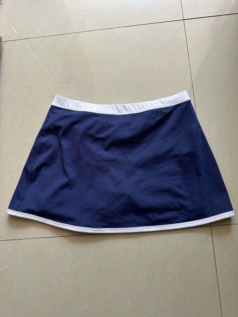 j.crew Active Navy Blue Skort Size M 30-35 (Category: Activewear) located in Rosales. Submitted by dariang22 (Listing ID 1465411368, Image 3). Description: - Brand: J.Crew Active - Item: Athletic Skort - Color: Navy blue with white trim and wrap front - Features: Built-in blue and white striped shorts, elastic waistband with logo - Size: M - Material: 77% polyester, 23% elastane (machine washable) - Condition: Excellent, clean, zero flaws.
