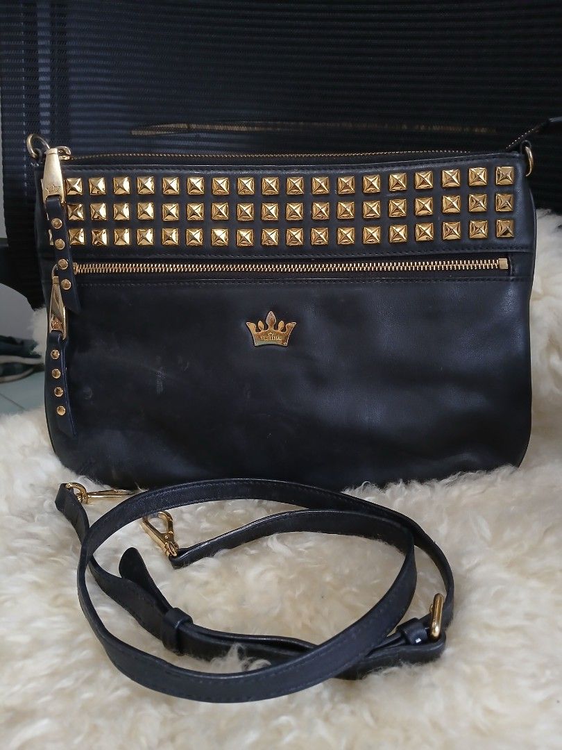 j.estina Black Leather Studded Shoulder Bag (Category: Shoulder Bags) located in Taguig. Submitted by demsclosetph (Listing ID 1465419918, Image 1). Description: - Brand: J.ESTINA - Material: Black leather with striking gold pyramid studs - Features: Vertical front zip pocket, signature crown logo hardware, and a versatile detachable shoulder strap - Interior: Fabric lining equipped with convenient slip and zipper pockets - Condition: Minor scuff