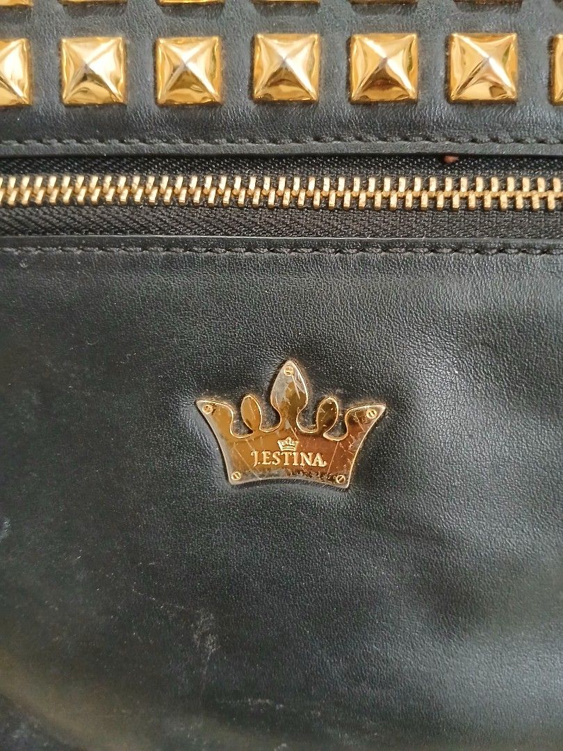 j.estina Black Leather Studded Shoulder Bag (Category: Shoulder Bags) located in Taguig. Submitted by demsclosetph (Listing ID 1465419918, Image 2). Description: - Brand: J.ESTINA - Material: Black leather with striking gold pyramid studs - Features: Vertical front zip pocket, signature crown logo hardware, and a versatile detachable shoulder strap - Interior: Fabric lining equipped with convenient slip and zipper pockets - Condition: Minor scuff