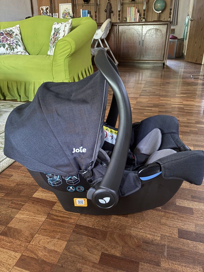 Joie Gemm Infant Car Seat (Category: Car Seats) located in San Fernando. Submitted by abbp______ (Listing ID 1465489151, Image 3). Description: - Joie Gemm infant car seat in stylish black and grey - Includes cozy newborn head support insert - Secure 5-point harness system with fully functioning buckles - Adjustable carry handle for easy transport - Retractable canopy hood for sun protection - Convenient installation diagrams printed on the side 