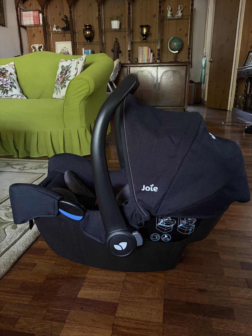 Joie Gemm Infant Car Seat (Category: Car Seats) located in San Fernando. Submitted by abbp______ (Listing ID 1465489151, Image 2). Description: - Joie Gemm infant car seat in stylish black and grey - Includes cozy newborn head support insert - Secure 5-point harness system with fully functioning buckles - Adjustable carry handle for easy transport - Retractable canopy hood for sun protection - Convenient installation diagrams printed on the side 