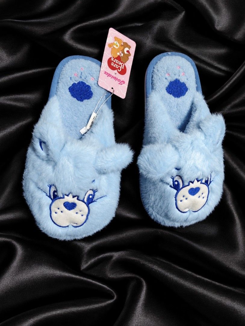 Joivida x Care Bears Blue Plush Slippers (Category: Slippers and slides) located in Bulacan. Submitted by heathersdream.c0 (Listing ID 1465449042, Image 1). Description: org. price: 750 pesos - Brand new with hang tag still attached - Fluffy blue slippers with cute embroidered bear face and ears - Adorable paw print design on the footbed - Soft plush material inside and out for maximum comfort - Super cozy and perfect for lounging around the hous