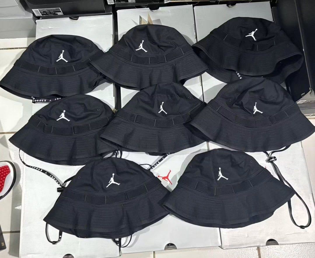 Jordan Black Bucket Hat (Category: Caps & Hats) located in Agdangan. Submitted by chano11339 (Listing ID 1465560236, Image 1). Description: - Color: Classic black with white embroidered Jumpman logo - Material: Durable, sturdy fabric construction - Features: Unique wrap-around strap detail near the crown - Fit: Adjustable chin strap with branded lettering for a secure fit - Availability: Multiple pieces available (Brand New).