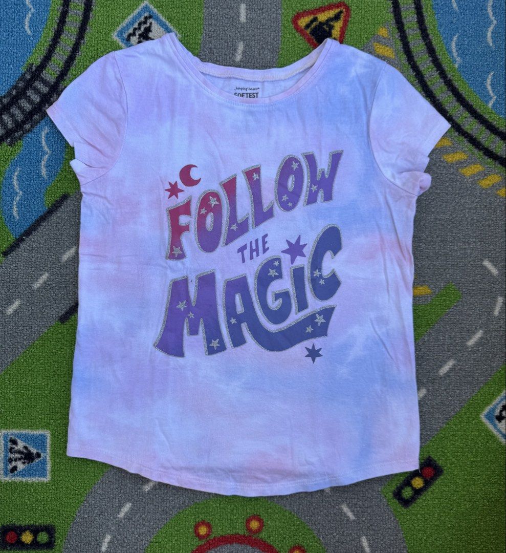 Jumping Beans Tie Dye T-Shirt (Category: Babies & Kids Fashion) located in Rizal. Submitted by preloovved (Listing ID 1465501171, Image 1). Description: Super soft Jumping Beans tie-dye shirt in purple and blue, featuring a 'Follow the Magic' graphic with silver glitter stars and a moon. Short sleeves and a comfy round neckline, perfect for everyday wear. Preloved, 7yo Meet-up only in GB1 San Mateo, Rizal Shipping fee c/o buyer. Tres Marias or J&