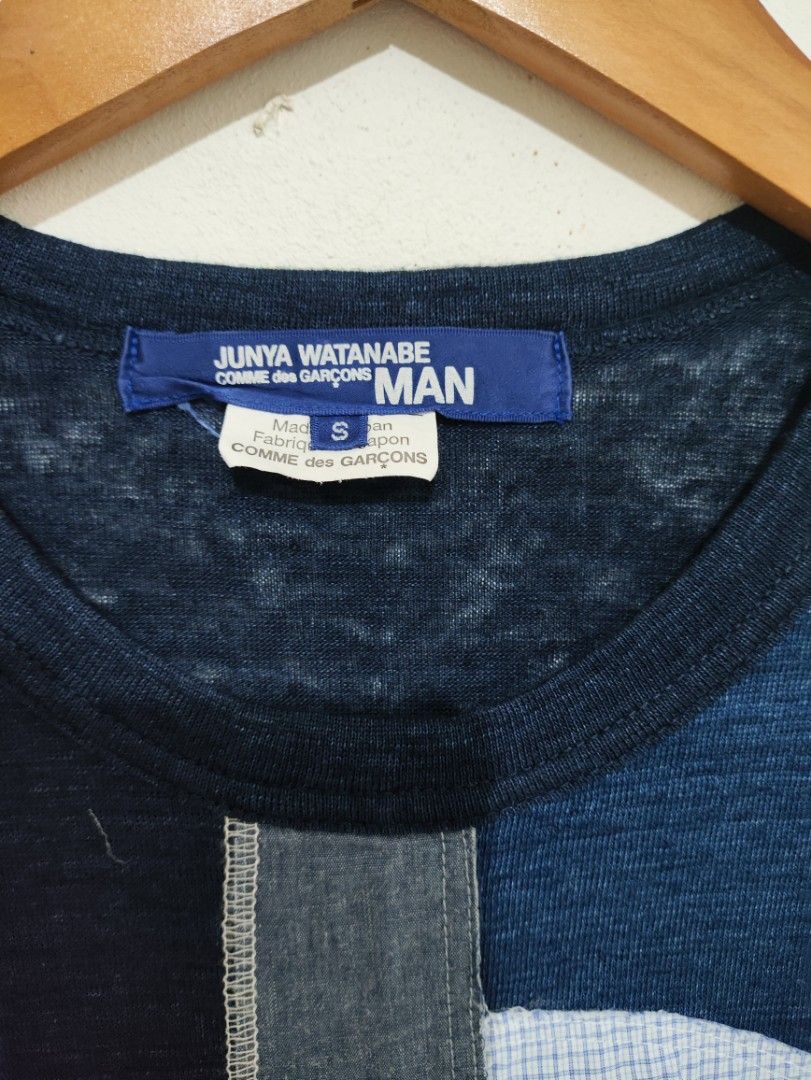Junya Watanabe Comme des Garçons MAN Patchwork Tee (Category: Shirts) located in Puerto Princesa. Submitted by johnareis162386 (Listing ID 1465416252, Image 2). Description: - Brand: Junya Watanabe Comme des Garçons MAN - Color: Dark blue - Size: Small - Material: Cotton and linen blend - Origin: Made in Japan - Details: Abstract fabric collage front panel with mixed patterns, stripes, and burlap textures, raw hem detailing, and side slits fits m