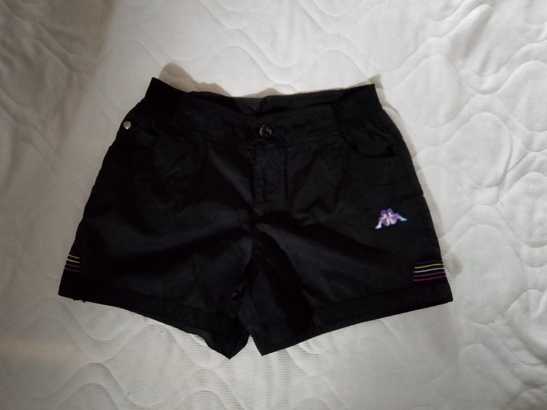Kappa Black Shorts Size M (Category: Shorts) located in Aroroy. Submitted by itsyviii (Listing ID 1465526401, Image 1). Description: - Brand: Kappa - Color: Black with colorful stripe accents - Size: Medium (M) - Details: Embroidered front logo, light purple 'kappa' embroidery on back waistband, functional front pockets, and button waist closure - Condition: Great sporty piece, perfect for casual wear.