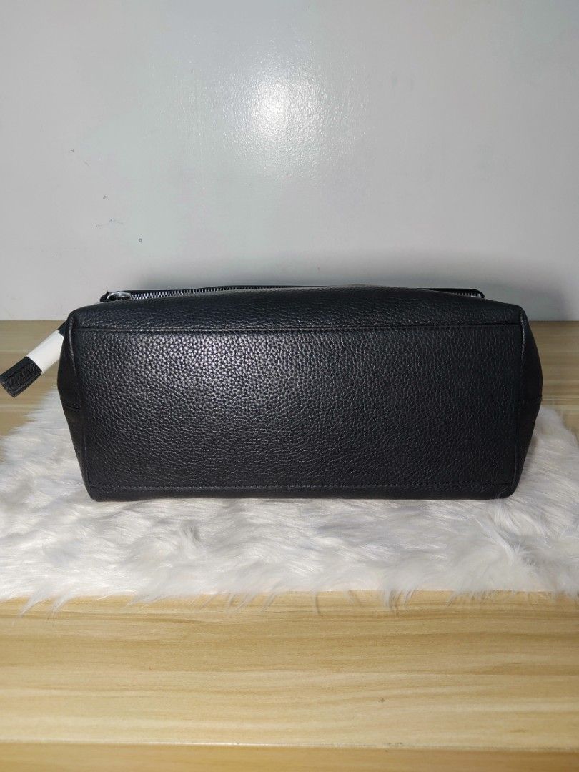 Kate Spade black leather shoulder bag (Category: Luxury Bags & Wallets) located in Quezon City. Submitted by nurturenest1018 (Listing ID 1465400815, Image 3). Description: - Brand: Kate Spade New York - Material: Premium black pebbled leather - Hardware: Silver-tone - Strap: Long and fully adjustable - Design: Foldover flap with front zipper pocket and playful tassel pull - Interior: Signature black spade jacquard fabric lining with an extra zip 
