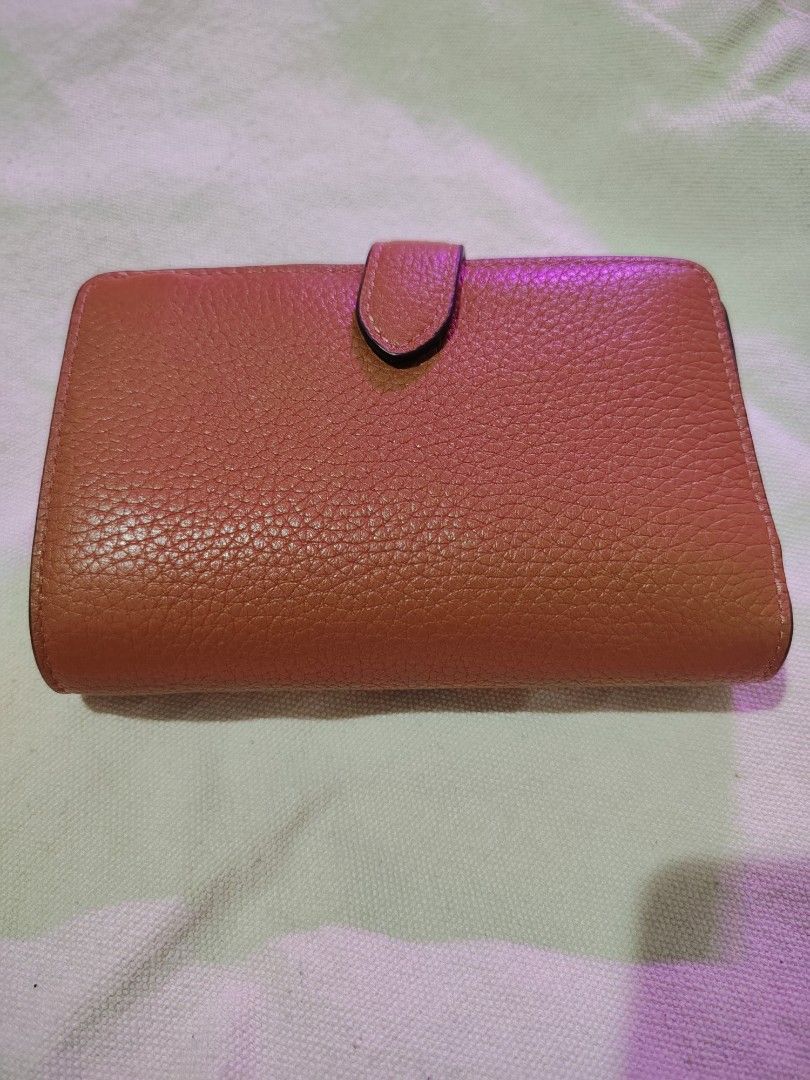 Kate Spade leather wallet (Category: Wallets & Card holders) located in Mandaluyong City. Submitted by declutter_kween (Listing ID 1465524868, Image 3). Description: - Brand: Kate Spade New York - Material: Clean pebbled textured leather - Color: Brown - Closure: Fold-over tab with secure snap - Details: Signature metal front lettering - Size: Compact, fits easily in smaller bags.