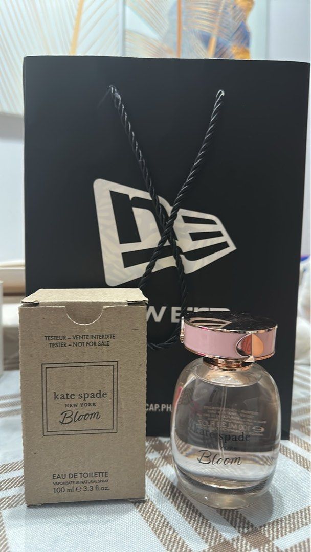 Kate Spade New York Bloom EDP 100ml (Category: Fragrance & Deodorants) located in Manila. Submitted by manrugamin14966 (Listing ID 1465414707, Image 1). Description: - Authentic Kate Spade Bloom EDP (100ml) - Tester but same DNA AS OROGINAL(no box) - Condition: Roughly full, barely sprayed - Fragrance profile: Light, fresh floral scent - Features a gorgeous clear glass bottle with a pink cap accent - Perfect for daily wear or gifting at a fractio