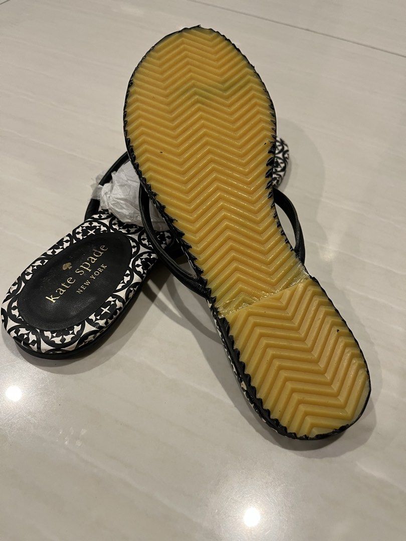 Kate Spade Toe-Post Flat sandals (Category: Flats & Sandals) located in Muntinlupa City. Submitted by jane226ph (Listing ID 1465498532, Image 2). Description: Original and Authentic Charming Kate Spade piece. Like New Signature printed footbed with bow detailing. Kept in storage and never used Upper and straps remain in good condition. Original outsole replaced with a brand new outsole due to deterioration from storage. Purchased in-store Sold as