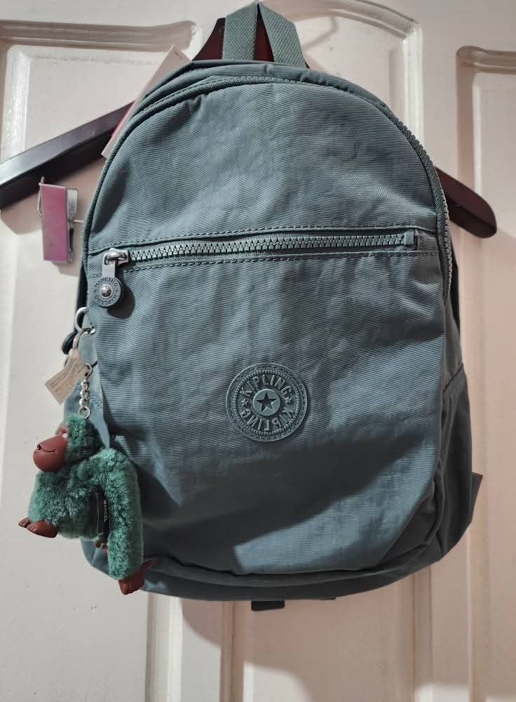 KIPLING CHALLENGER Backpack (Category: Backpacks) located in Quezon City. Submitted by senyoramaria2 (Listing ID 1465549576, Image 2). Description: KIPLING CHALLENGER Backpack Color: Light Aloe Volume: 16 Liters Dimensions: 10.25 x 14.5 x 8.25 inches Nylon Zipped main compartment with padded back panel and base. Front zipped pocket features an open pouch pocket, pen loop and key clasp. Additional external zipped pocket on front. Adjustable padded