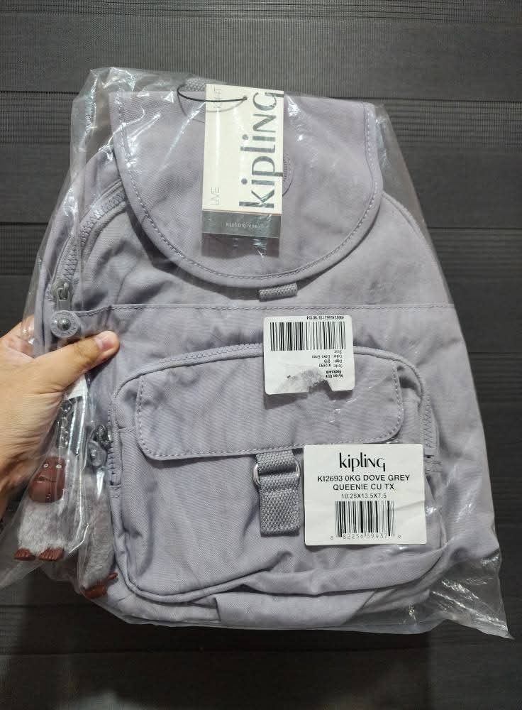 KIPLING QUEENIE Backpack (Category: Backpacks) located in Quezon City. Submitted by senyoramaria2 (Listing ID 1465549669, Image 1). Description: KIPLING QUEENIE Backpack Color: Dove Grey (Lilac) Volume: 12 Liters Dimensions: 10.25 x 13.5 x 7.5 inches Nylon Top handle Adjustable shoulder straps Front magnetic pocket Two front zip pockets Magnetic closure Zip around closure Monkey keychain Key clasp Note: Kasya tablet, folding umbrella and 8 notebo