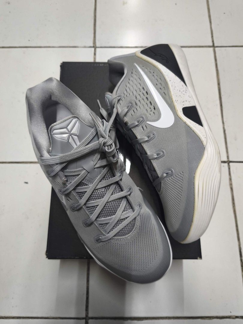 Kobe 9 Wolf Grey (Category: Sneakers) located in Marikina City. Submitted by renzo. (Listing ID 1465573161, Image 1). Description: - Authentic grey Nike basketball shoes - Features the iconic Kobe sheath logo on the tongue and signature on the heel - Breathable textured mesh upper for maximum comfort on and off the court - Eye-catching white and speckled midsole design - Includes original black shoe box - Condition: Brand new / Excellent (ready t
