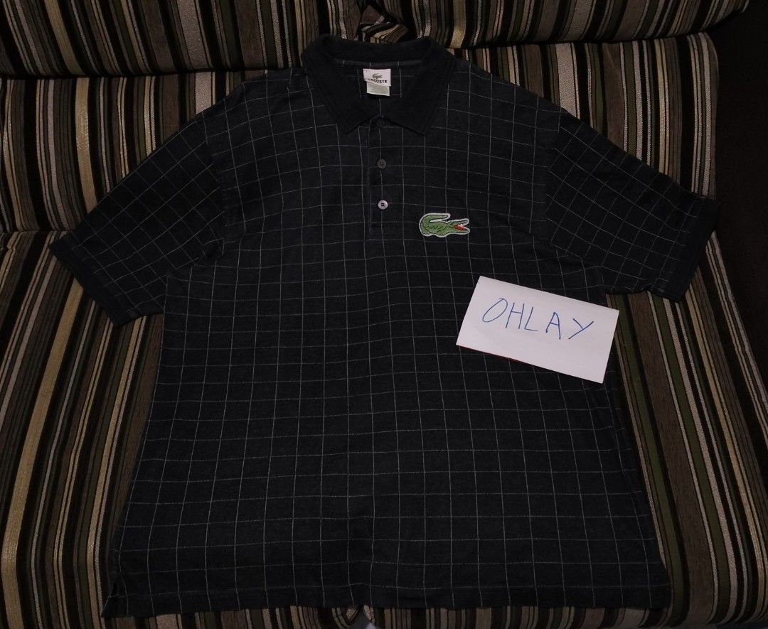 Lacoste Grid Polo Shirt Size 7 (Category: Tshirts & Polo Shirts ) located in Taguig. Submitted by conniemdcruz (Listing ID 1465516916, Image 1). Description: - Brand: Lacoste - Color: Dark grey with an all-over white grid pattern - Size: 7 - Features: Classic collar with two front buttons, signature embroidered green crocodile patch - Origin: Designed in France, Made in Peru - Condition: Excellent pre-loved condition - Mode of Payment: GCash or B