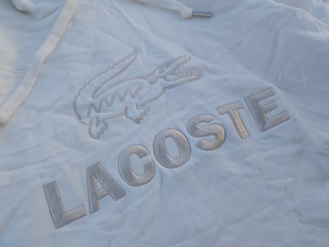 Lacoste Hoodie 🔥 (Category: Coats, Jackets and Outerwear) located in Tabaco. Submitted by thrifttobecool (Listing ID 1465488796, Image 2). Description: Very Good Condition 💯 9.5/10 Color Rate 💯 18.5 Width 📌 24 Length 📌 S - M ✅ issue: small scratch & need wash 📌 450 ✅ + sf 📌 Location Bicol ✅.