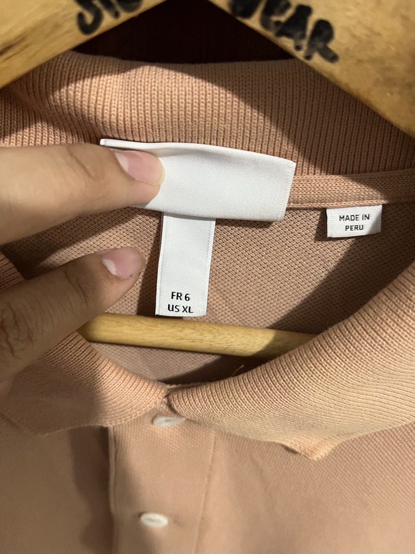 Lacoste Peach Polo (Category: Tshirts & Polo Shirts ) located in Manila. Submitted by 6amthrift (Listing ID 1465434845, Image 3). Description: 22 x 28.