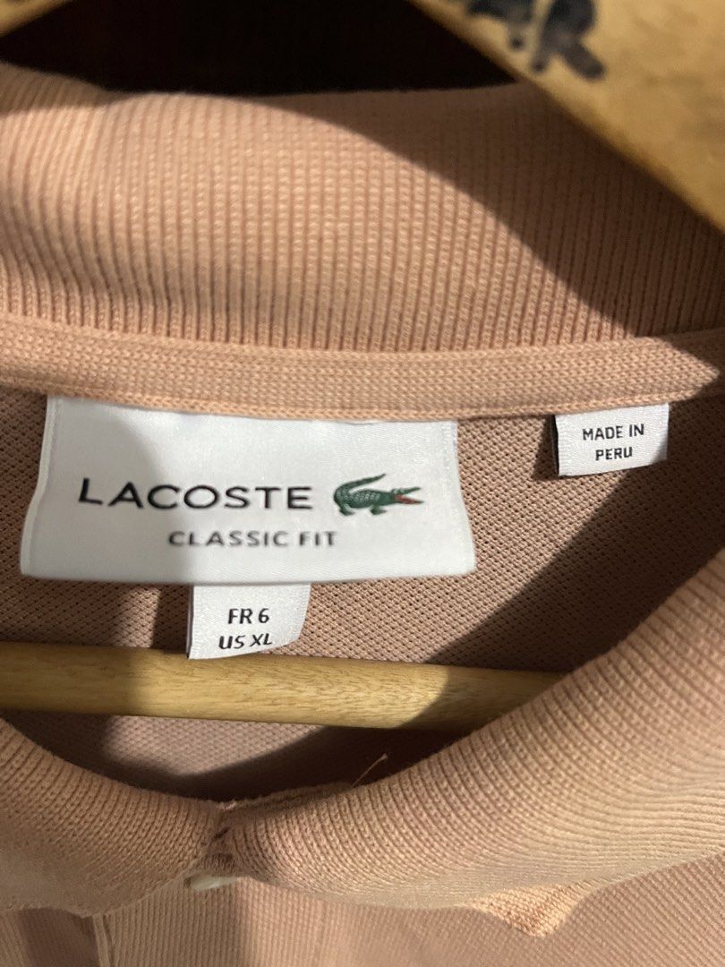 Lacoste Peach Polo (Category: Tshirts & Polo Shirts ) located in Manila. Submitted by 6amthrift (Listing ID 1465434845, Image 2). Description: 22 x 28.