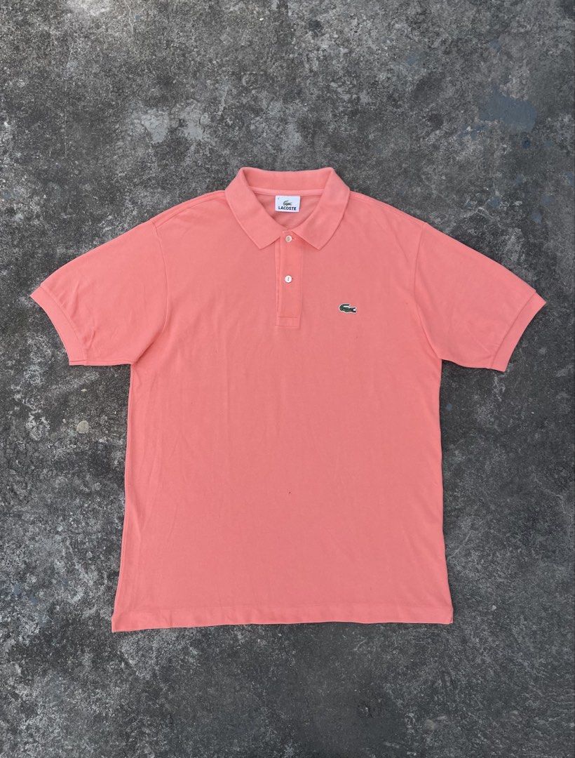 Lacoste Peach Polo Shirt Size 4 (Category: Tshirts & Polo Shirts ) located in Manila. Submitted by ajzeemlimbamidzid (Listing ID 1465512062, Image 1). Description: - Brand: Lacoste - Color: Peach pink - Size: 4 (Tag on collar) - Material: 100% cotton pique - Details: Two mother-of-pearl buttons, embroidered green crocodile logo on chest, Devanlay care label - Origin: Made in Tunisia.