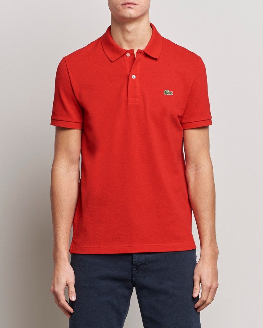 Lacoste Red Polo Shirt ( medium fitting) (Category: Tshirts & Polo Shirts ) located in Arayat. Submitted by keenwolf-a7b5 (Listing ID 1465456750, Image 1). Description: - Brand: Lacoste - Color: Vibrant red - Material: Classic cotton piqué - Size: 5 - medium fitting - Dimes 20.5 x 26.5 - Details: Two-button placket with pearlescent buttons, signature embroidered green crocodile logo on the chest - Features: Ribbed collar and sleeve cuffs, standar