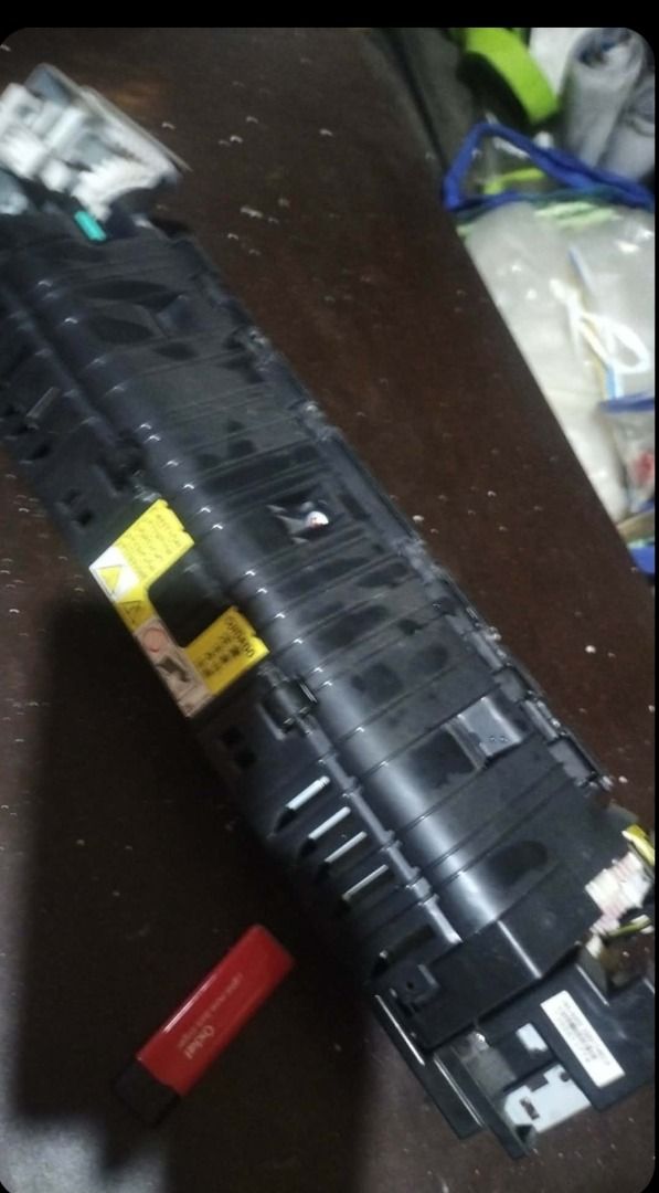 Laser Printer Fuser Assembly Heater Unit Replacement (Category: Printers, Scanners & Copiers) located in Caloocan City. Submitted by copiermach60483 (Listing ID 1465531969, Image 2). Description: - Genuine printer fuser unit replacement part - Heavy-duty metal and plastic construction with wiring harness and rollers - Pulled from a working office machine - Features clean gear assembly and intact electrical connector ports - Normal cosmetic wear o