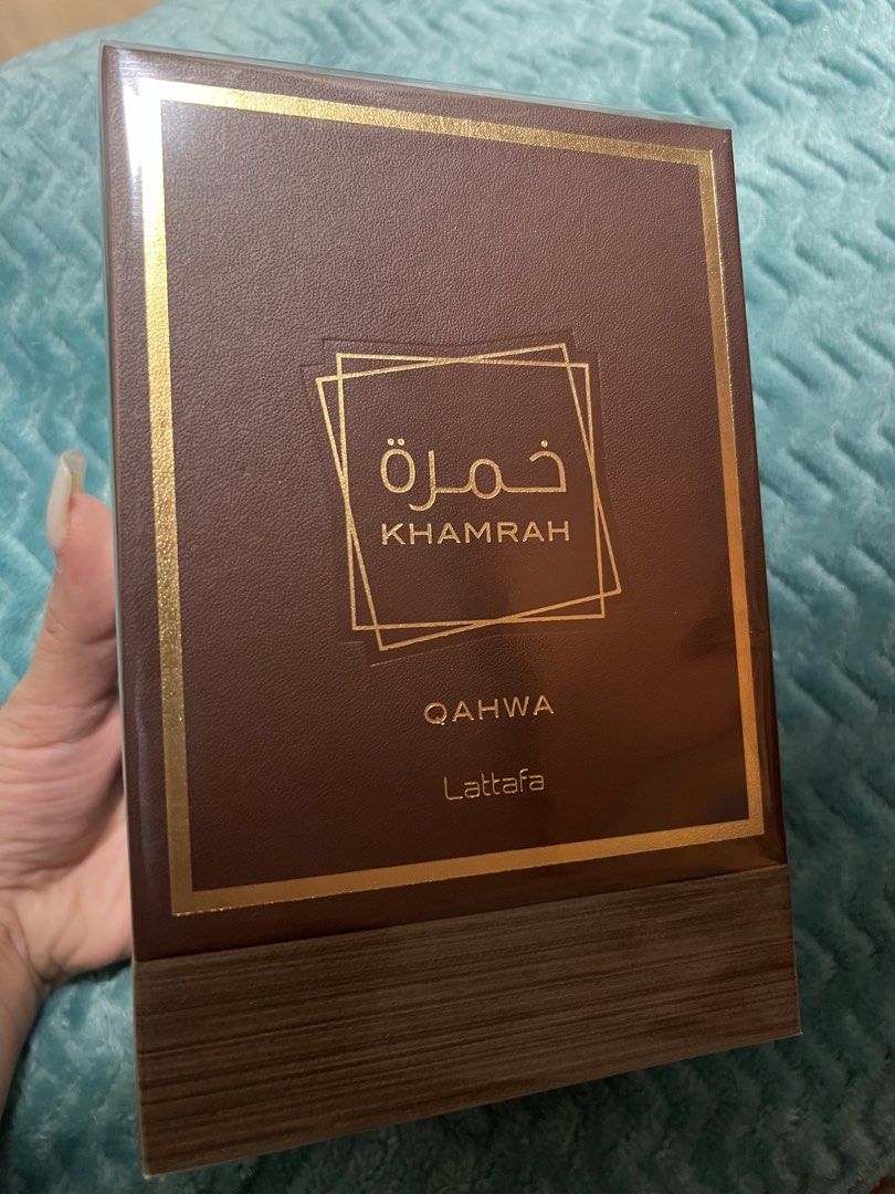 Lattafa Khamrah Qahwa Eau de Parfum 100ml (Category: Fragrance & Deodorants) located in Angeles City. Submitted by ldmtrading (Listing ID 1465394809, Image 3). Description: - Authentic Lattafa Khamrah Qahwa fragrance with original textured outer box - Warm and rich scent profile featuring rich coffee and warm spices - Ideal for cooler weather or evening wear - Clear glass bottle with elegant gold label and matching metallic atomizer cap - Brand n