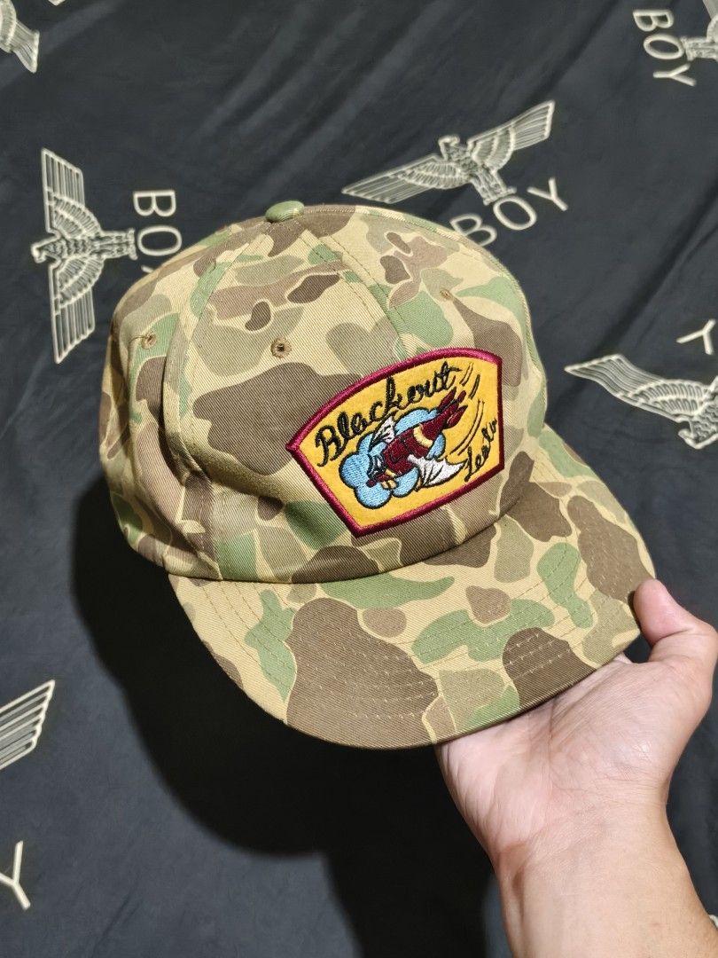 LEATA Camouflage Snapback Cap With Blackout Patch (Category: Caps & Hats) located in Cagayan de Oro. Submitted by epictiger_2a3d62 (Listing ID 1465412204, Image 1). Description: - Brand: LEATA - Style: Camo snapback cap with brown brim - Design: Embroidered Blackout patch and graphic on front - Material: 100% cotton - Closure: Adjustable leather strap at the back - Condition: Clean, well-maintained, and free of stains or flaws -Issue: strap crack