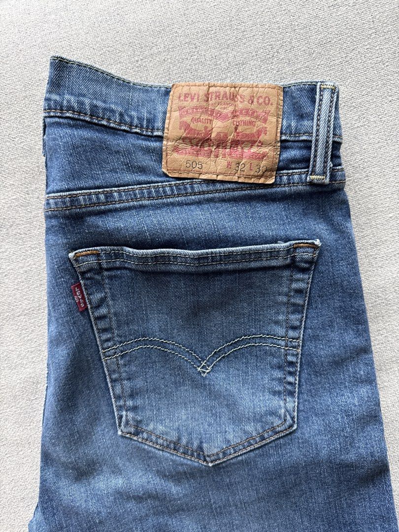 Levi's 505 Jeans (Category: Jeans) located in Makati City. Submitted by sabmi (Listing ID 1465446195, Image 1). Description: - Brand/Model: Levi's 505 Straight Fit Jeans - Wash: Classic medium blue with light fading on thighs - Size: Waist 32, Length 30 (W32 L30) - Details: Standard 5-pocket styling, zip fly with button closure - Branding: Signature leather patch on back waistband and red tab on back pocket - Material: Sturdy, durable denim fabri