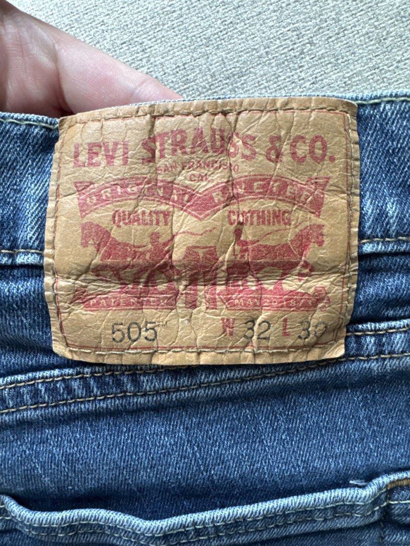 Levi's 505 Jeans (Category: Jeans) located in Makati City. Submitted by sabmi (Listing ID 1465446195, Image 2). Description: - Brand/Model: Levi's 505 Straight Fit Jeans - Wash: Classic medium blue with light fading on thighs - Size: Waist 32, Length 30 (W32 L30) - Details: Standard 5-pocket styling, zip fly with button closure - Branding: Signature leather patch on back waistband and red tab on back pocket - Material: Sturdy, durable denim fabri