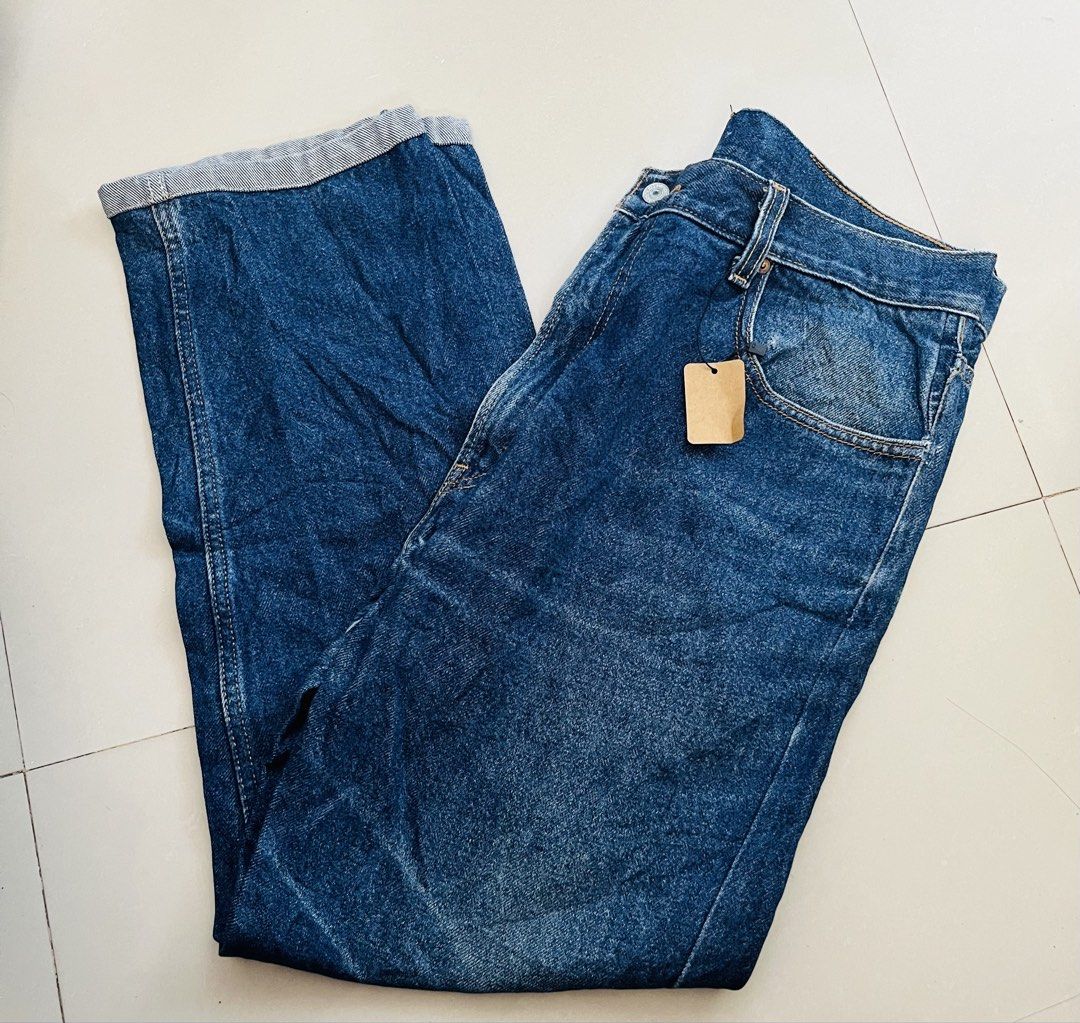 Levi's 505 Regular Fit Jeans W36 L32 (Category: Jeans) located in Manila. Submitted by bengirlclothing (Listing ID 1465578781, Image 2). Description: Classic Levi's 505 regular fit jeans in a medium dark blue wash. Made in Lesotho from 100 percent cotton denim. Features standard five-pocket styling, contrast yellow stitching, and the iconic red tab on the back pocket. Tagged waist 36, length 32..