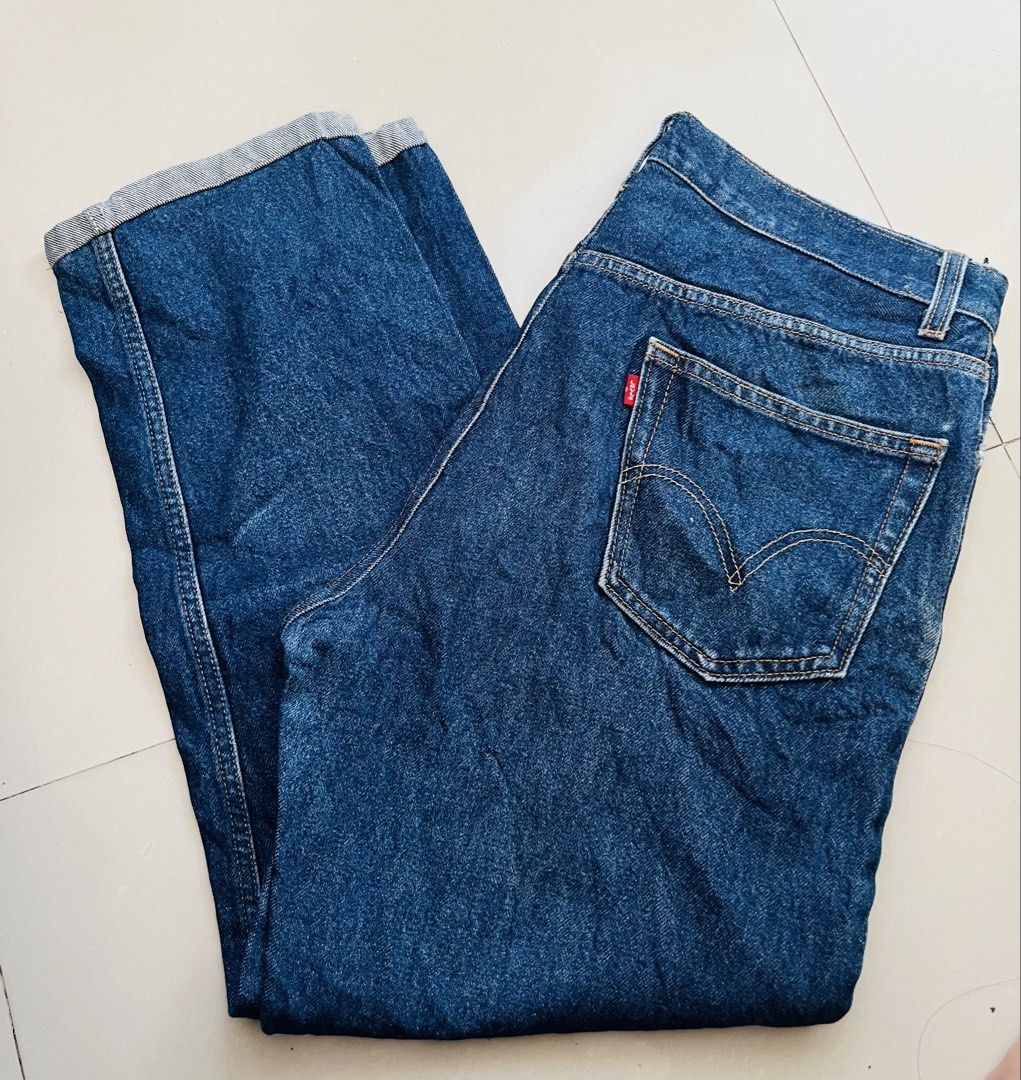 Levi's 505 Regular Fit Jeans W36 L32 (Category: Jeans) located in Manila. Submitted by bengirlclothing (Listing ID 1465578781, Image 1). Description: Classic Levi's 505 regular fit jeans in a medium dark blue wash. Made in Lesotho from 100 percent cotton denim. Features standard five-pocket styling, contrast yellow stitching, and the iconic red tab on the back pocket. Tagged waist 36, length 32..