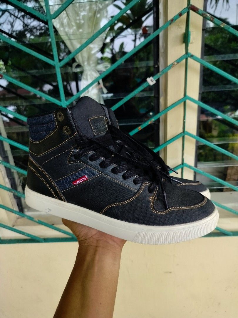 Levi's Black High Top Sneakers Size 9.5 (Category: Sneakers) located in Manila. Submitted by gerald_quinto (Listing ID 1465482281, Image 1). Description: - Brand: Levi's - Style: High top sneakers - Size: 9.5 (marked on interior tongue tag) - Color: Black with white rubber outsoles and black laces - Details: Contrast stitching, stylish denim accent panels, and signature red Levi's tab on the side - Condition: Excellent buyer-friendly everyday foo