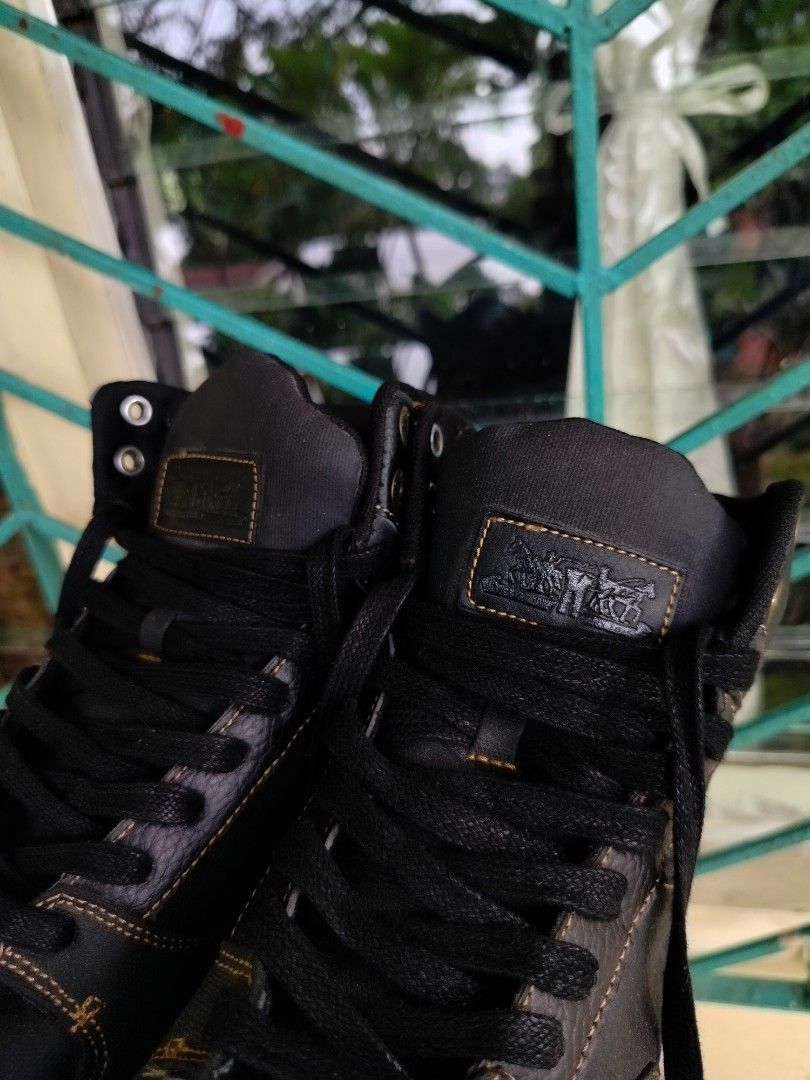 Levi's Black High Top Sneakers Size 9.5 (Category: Sneakers) located in Manila. Submitted by gerald_quinto (Listing ID 1465482281, Image 3). Description: - Brand: Levi's - Style: High top sneakers - Size: 9.5 (marked on interior tongue tag) - Color: Black with white rubber outsoles and black laces - Details: Contrast stitching, stylish denim accent panels, and signature red Levi's tab on the side - Condition: Excellent buyer-friendly everyday foo